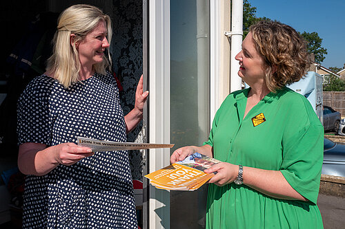 Anna canvassing in a green shirt